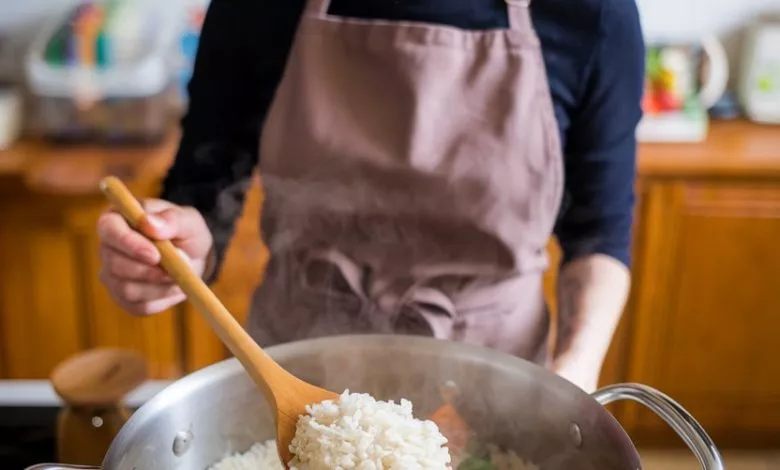 A Photo Of A Woman Cooking Rice She Is W Pebgbzmhqfmcdiuy4u2w9w Gnr2dafxswkqwv9pf7zaew